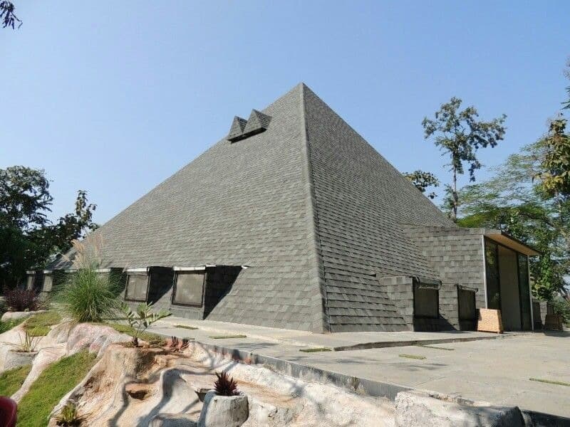 Meditators near a pyramid hall